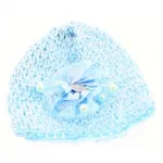 Bonnet bébé orné d’une fleur à pois et perles