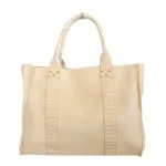 Sac à main orné de clous dorés