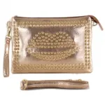 Sac à main motif lèvre clouté