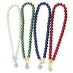 Collier en perles avec pendentif fantaisie à strass